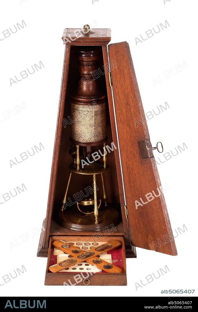 Scientific instrument, Culpepper Compound Microscope, with Case, 1725-30 The compound microscope was invented in the early seventeenth century. Until around 1740, all microscopes consisted of a thin wooden or cardboard cylinder, generally covered with shagreen (shark skin) or leather. Culpepper is one of the great names associated with early microscopes. This one has its own fitted oak case with a drawer to the bottom. There are also several boxwood specimen slides. Wood, Science and Industry, Social history, Health and Medicine.