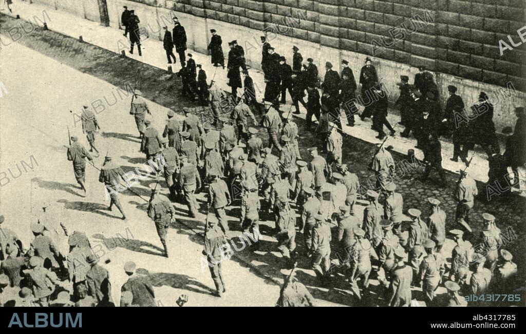 German prisoners from the SMS 'Magdeburg' in Petrograd, Russia, First World War, August 1914, (c1920). 'Russia's Naval Prisoners: survivors of the wrecked German Cruiser Magdeburg arriving at Petrograd [Saint Petersburg]'. The 'Magdeburg' ran aground at Odensholm, off the Estonian coast, on 26 August. Russian forces shelled the stranded cruiser and took the crew prisoner. From "The Great World War - A History" Volume I, edited by Frank A Mumby. [The Gresham Publishing Company Ltd, London, c1920].