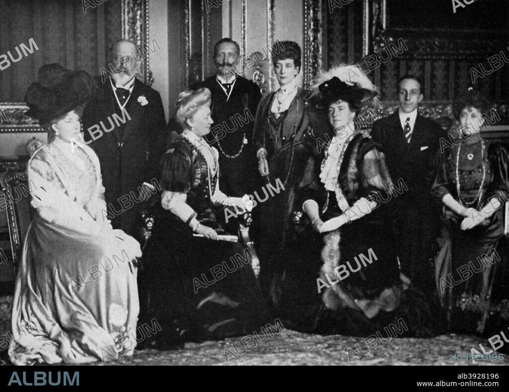 European royalty at Windsor Castle, 17th November 1907 (1964). Queen Ena of Spain, King Edward VII, the German Empress, Kaiser Wilhelm II of Germany, Queen Alexandra, Queen Amelia of Portugal, King Alfonso of Spain and Queen Maud of Norway. A print from King Edward the Seventh, by Philip Magnus, William Clowes and Sons Ltd, London, 1964.