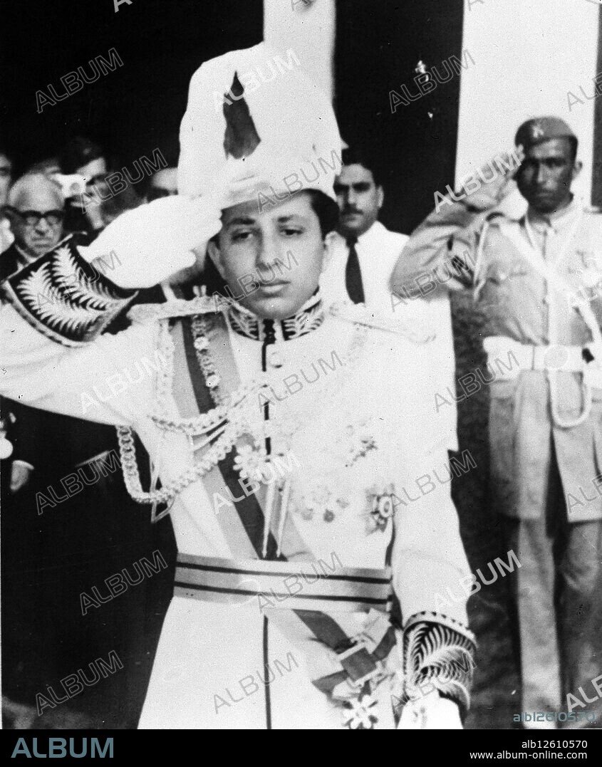 King Faisal II in a memorial photo, in front of his mother, Queen Alia, in Al Rehab Palace in Baghdad. Faisal II (1935 - 14 July 1958) was the last King of Iraq. He reigned from 4 April 1939 until July 1958, when he was killed during the 14 July Revolution. This regicide marked the end of the thirty seven year old Hashemite monarchy in Iraq, which then became a republic. (Photo by: Universal History Archive/Universal Images Group via Getty Images).