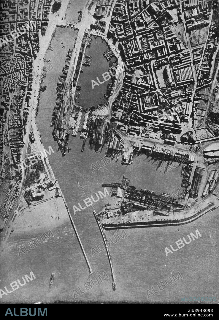 Invasion barges massed in Boulogne harbour, France, 1940 (1943). German invasion barges waiting on the French coast during the Battle of Britain. Operation Sea Lion was Nazi Germany's plan to invade the United Kingdom during World War II. From Coastal Command. [His Majesty's Stationery Office, London, 1943].
