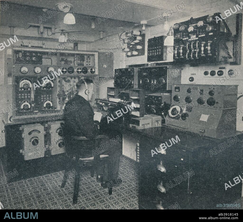'A Marconi wireless operator receiving wireless messages as the Empress of Britain crosses the Atlantic', c1934. Guglielmo Marconi (1874-1937), an Italian physicist and inventor, sent the first radio signals across the Atlantic using a transmitter developed from this one. He later developed short-wave radio equipment, and established a worldwide radio telegraph network for the British government. In 1909 he was awarded the Nobel Prize for Physics. From The Treasury of Knowledge. [Richard Clay & Sons, Ltd., Bungay, Suffolk, 1934].