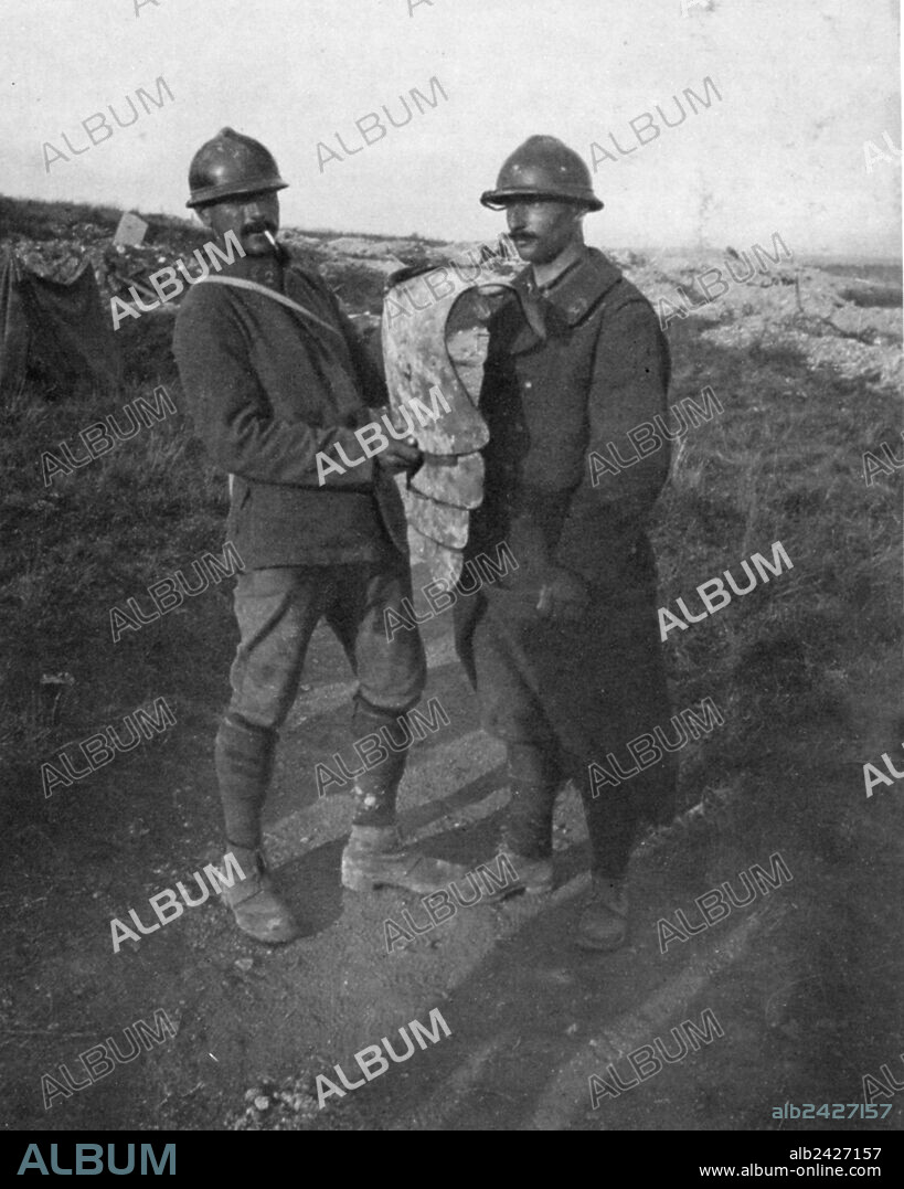 World War 1 1914 1918-Two soldiers show an armor of the German assault troops. 1917.