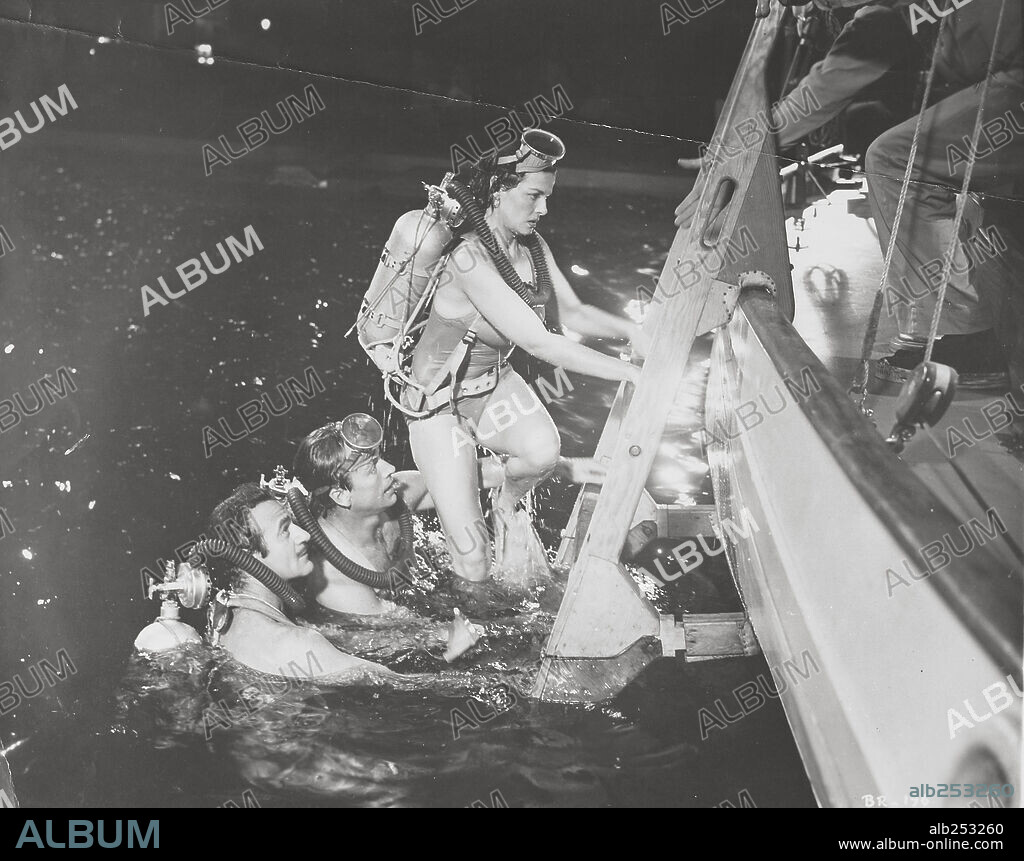 GILBERT ROLAND, JANE RUSSELL and RICHARD EGAN in UNDERWATER!, 1955, directed by JOHN STURGES. Copyright RKO.