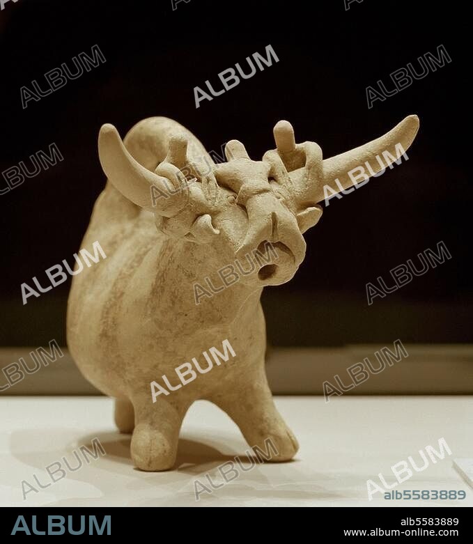 Early Middle Bronze Age, Greece, Early Minoan II - Middle Minoan I, End 3rd, beginning 2nd millennium B.C. Rhyton in the form of a bull, with bull jumpers. Clay, height with grip 15 cm, width 20.5cm. Found: Beehive grave at Koumasa, Crete, Greece. Inv. No. 4126. Heraklion, Archaeological Museum.