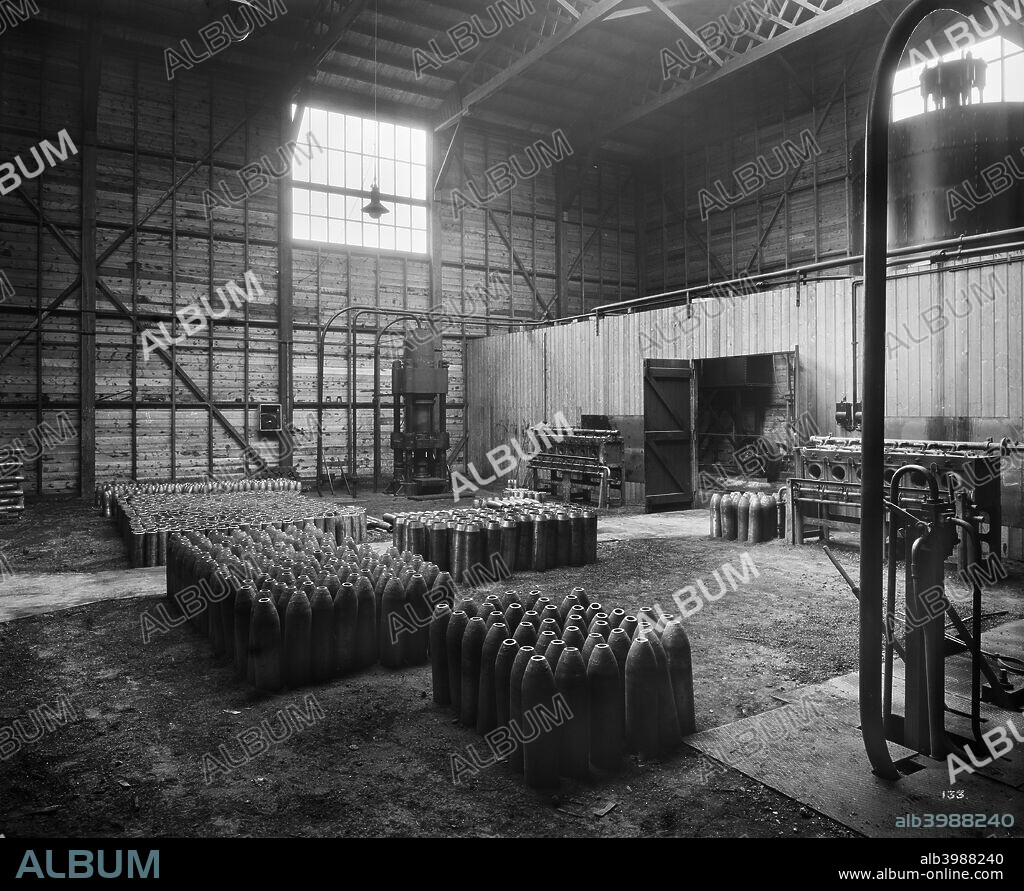 Cunard Shell Works, Bootle, Merseyside, September 1917. Artillery shell casings at various stages of completion, standing in a storage area.  In 1915 the Cunard Steamship Company?s store and engineering works at Rimrose Road, Bootle, was converted into a munitions factory. Four-and-a-half-inch, six-inch and eight-inch shells were brought to Cunard's Shell Works to be finished, checked and varnished before being taken to another factory in the area to be filled with explosive.