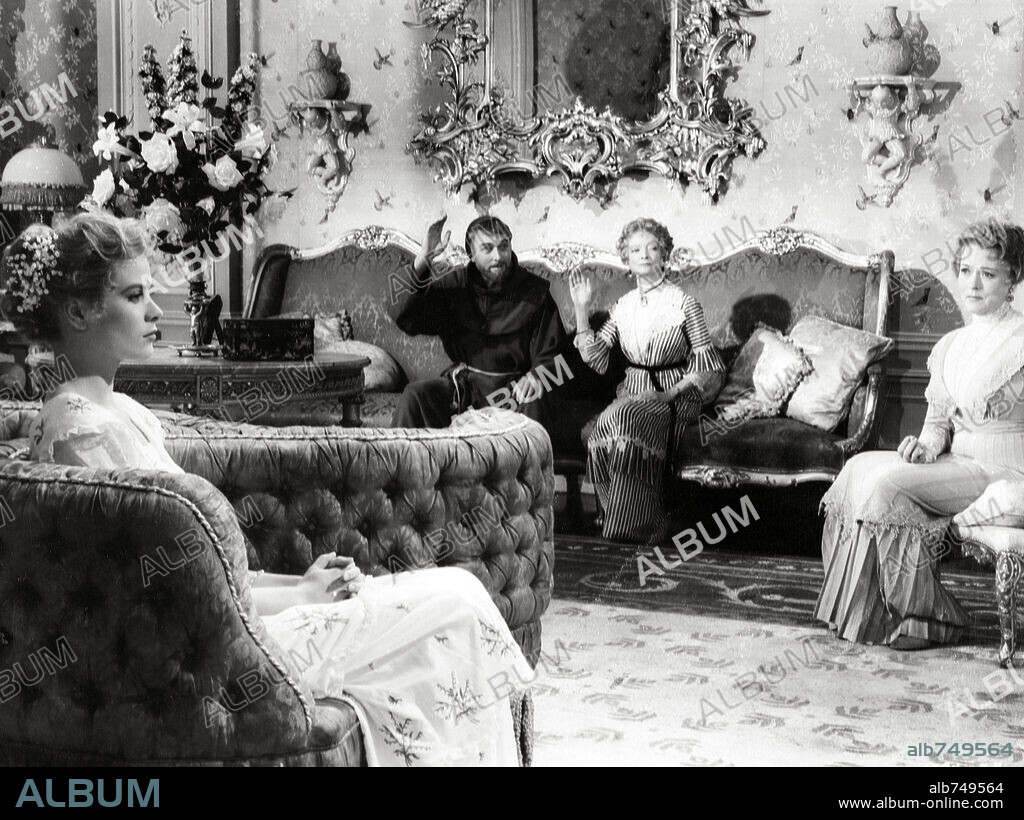 BRIAN AHERNE, GRACE KELLY and JESSIE ROYCE LANDIS in THE SWAN, 1956, directed by CHARLES VIDOR. Copyright M.G.M.