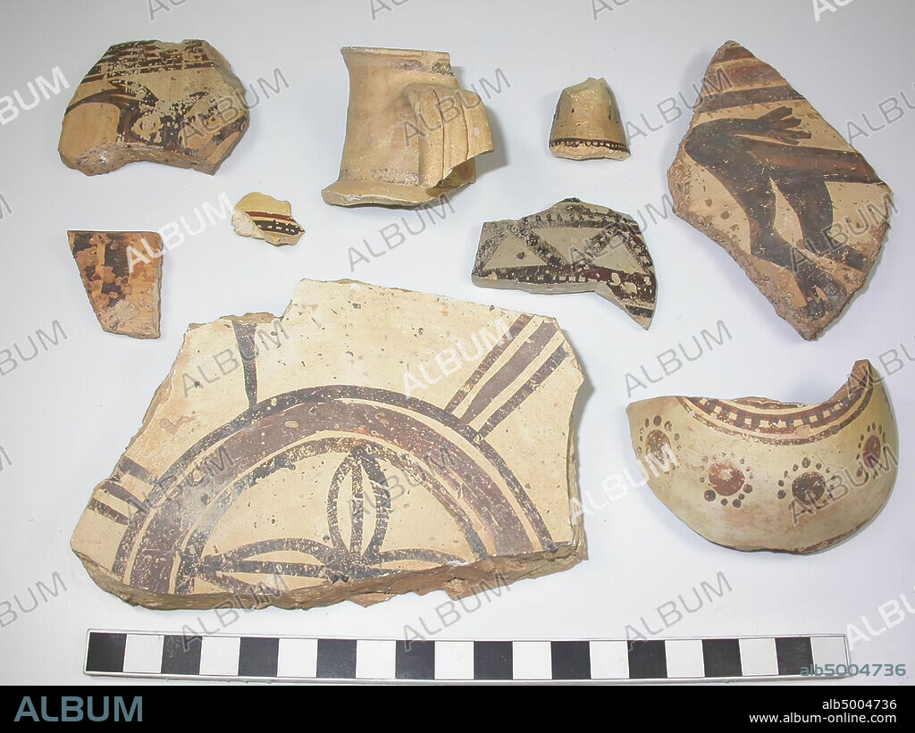 9 shards of the type Midianite Pottery or Al-Qurayya ware. Yellowish clay with many black inclusions. Geometric ornaments in black and red-brown. One shard, a bottom fragment, has as decoration a rosette, two other animal figures., Crockery, earthenware, average thickness: (thickest shard) 1.5 cm., (Thinnest shard) 0.4 cm., Late Bronze Age 1300-1100 BC. Saudi Arabia.