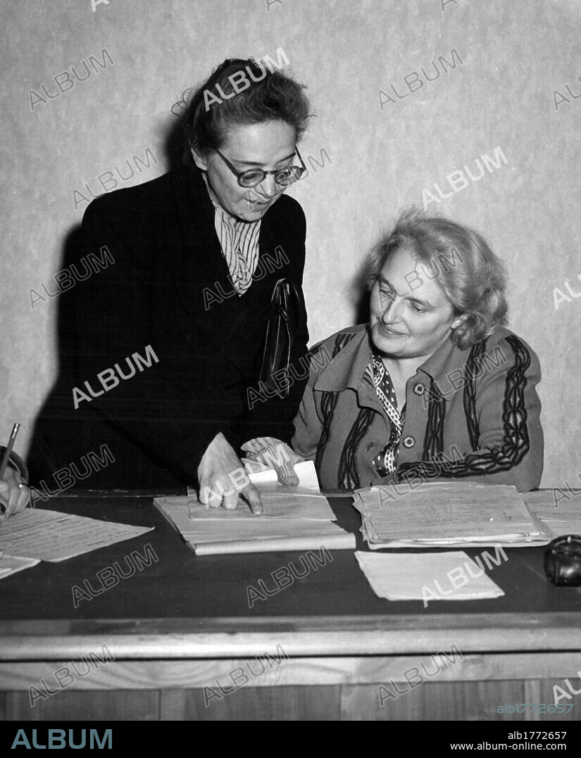 Rita Montagnana Togliatti with Emilia Siracusa Cabrini. The president of the Union of Italian Women Rita Montagnana Togliatti and Emilia Siracusa Cabrini taking part in a meeting for the redistribution of U.S. aid. Rome, November 1944.