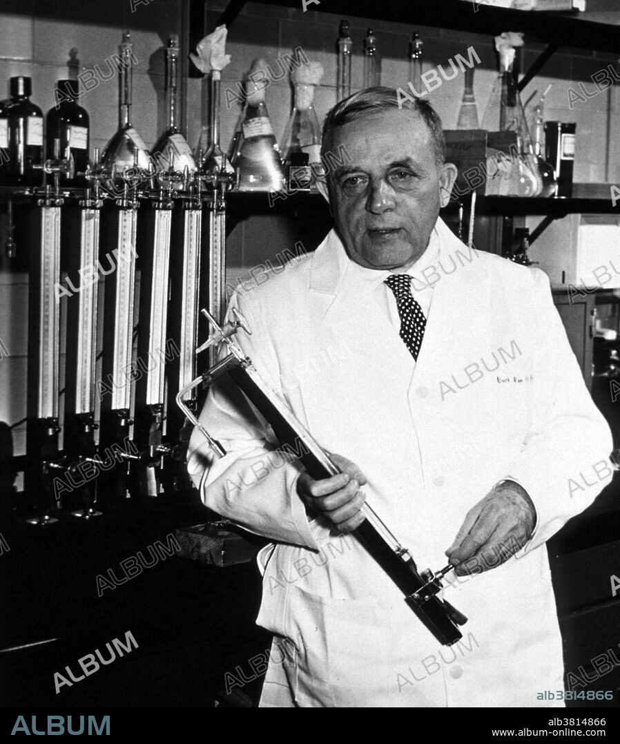 Warburg in laboratory wearing lab coat and holding an unidentified instrument. No date or location given. Otto Heinrich Warburg (1883-1970) was a German physician and physiologist. He served as an officer in the elite Uhlans (cavalry) on the front during the First World War where he won the Iron Cross. Towards the end of the war Albert Einstein wrote Warburg asking him to leave the army and return to academia. In 1918 Warburg was appointed Professor at the Kaiser Wilhelm Institute for Biology and later named Director of the Kaiser Wilhelm Institute for Cell Physiology. Warburg investigated the metabolism of tumors and the respiration of cells, particularly cancer cells, and in 1931 was awarded the Nobel Prize in Physiology for his "discovery of the nature and mode of action of the respiratory enzyme." In 1944, he was nominated for a second Nobel Prize in Physiology for his work on nicotinamide, the mechanism and enzymes involved in fermentation, and the discovery of flavine, but he did not win. In his later years Warburg was convinced that illness resulted from pollution and became a health advocate. He died in 1970 at the age go 86.