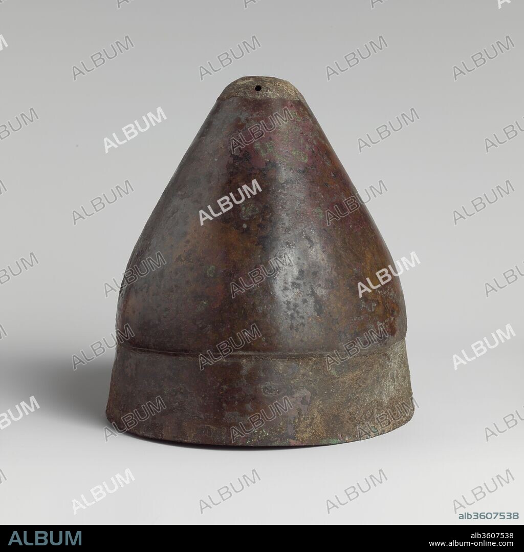 Bronze pilos (helmet of conical shape). Culture: Greek. Dimensions: 8 1/16in. (20.5cm). Date: 5th century B.C. or later.
The type of helmet known as a pilos is derived from a felt cap of similar shape, often included in depictions of herdsmen and others who worked outdoors.