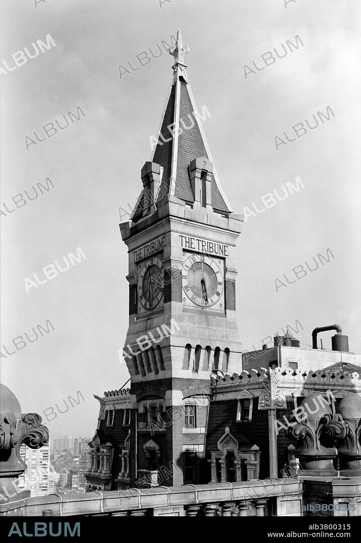 The New York Tribune Building was a building built by Richard Morris Hunt in 1875. It was built as the headquarters of the New York Tribune, and was a brick and masonry structure topped by a Clock Tower. The Tribune was located at 154 Printing House Square on Nassau and Spruce streets, stood 260 feet tall and was one of the first high-rise elevator buildings. Originally a 9 story building, between 1903 and 1905, nine more floors were added by the architects D'Oench & Yost and L. Thouyard to make it an 18 story building. The building has been put forward as a possible candidate as the first ever skyscraper. Pace University held its first classrooms in the building, renting out one room in 1906. The building was demolished in 1966 to make room for the 1 Pace Plaza building. Historic American Buildings Survey, John Feulner, Photographer March 1966.