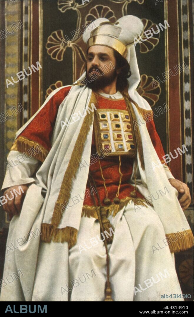 HENRY TRAUT. Caiaphas, 1922. Hugo Rutz as high priest Joseph ben Caiaphas in the Oberammergau Passion Play. The play is performed every 10 years, on open-air stages, by the inhabitants of the village of Oberammergau in Bavaria, Germany. First staged in 1634, the play tells the story of Jesus' passion, culminating in his crucifixion. The event has become a tourist attraction, with audiences coming from all over the world. Official postcard of the 1922 Oberammergau Passion Play. [F. Bruckmann, Munich, Germany, 1922].