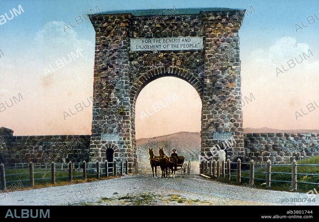 Postcard of the Roosevelt Arch at the north entrance photographed by Frank J. Haynes, no date. The Roosevelt Arch is a rusticated triumphal arch at the north entrance to Yellowstone National Park in Gardiner, Montana. Constructed under the supervision of the U.S. Army at Fort Yellowstone, its cornerstone was laid down by President of the United States Theodore Roosevelt in 1903. The top of the arch is inscribed with a quote from the Organic Act of 1872, the legislation which created Yellowstone, which reads "For the Benefit and Enjoyment of the People." Yellowstone National Park is a national park located primarily in the state of Wyoming, although it also extends into Montana and Idaho. It was established by the U.S. Congress and signed into law by President Ulysses S. Grant on March 1, 1872.