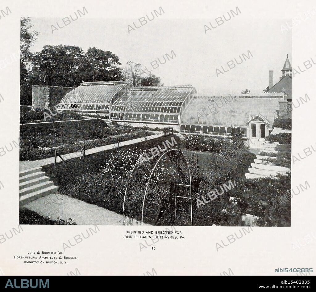 Catalogue of Greenhouses Irvington, N.Y, The Company, c1903, Catalogs, Greenhouses, Lord Burnham Co, The image showcases a beautifully designed greenhouse, featuring large glass panels that allow ample sunlight to filter through. This architectural structure is accompanied by a meticulously landscaped garden, complete with neatly arranged flower beds and greenery. A charming archway, possibly intended for climbing plants, adds an inviting element to the scene. The surrounding environment suggests a serene atmosphere, with trees providing a natural backdrop to the garden. The greenhouse is attributed to John Pitcairn in Breythears, Pennsylvania, reflecting a blend of functionality and aesthetic appeal in horticultural design.