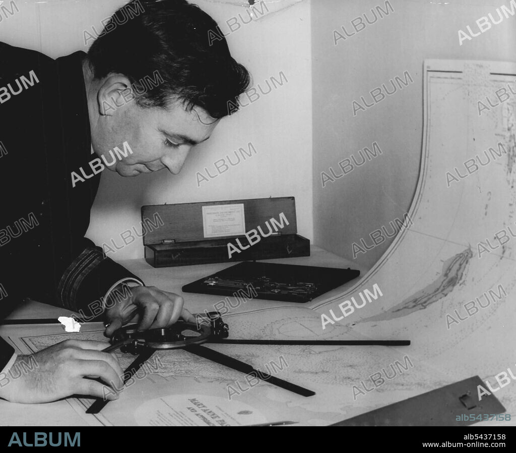 Not To Be Heed Until News Announced -- Not Commander R. J. Hardstaff, deputy senior officer Ran Hydrographic service and superintendent of the chart depot, checking a chart for HMAS warrego which is leaving to carry out survey duties in the monte bello area in connection with the projected atom bomb explosion. September 15, 1955. (Photo by Ronald Leslie Stewart/Fairfax Media).