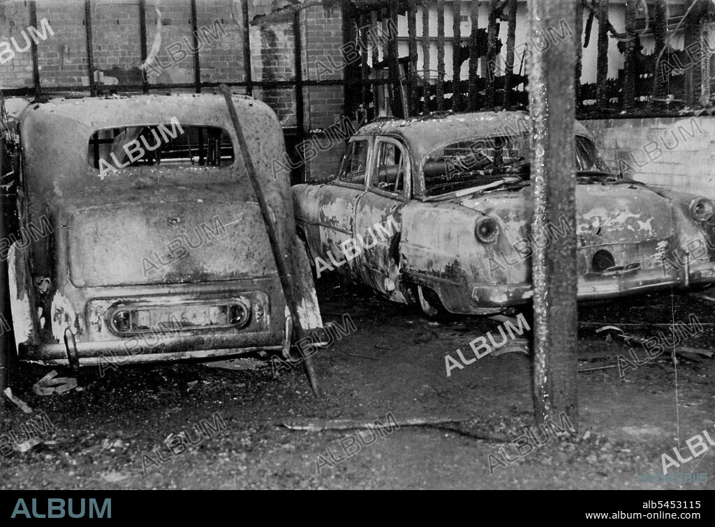 The cars belonging to Dr. Reginald Stuart Jones were destroyed by fire in their garage at his ***** in Arcadia Street, Coogee. The ***** pread from a nearby paddack.These cars, valued at £ 4000 and belonging to Dr. Reginald Stuart Jones, were completely wrecked last night when a fire swept through a garage in Arcadia St., Coogee. The fire is believed to have spread to the garage from a nearby paddock. June 22, 1954.