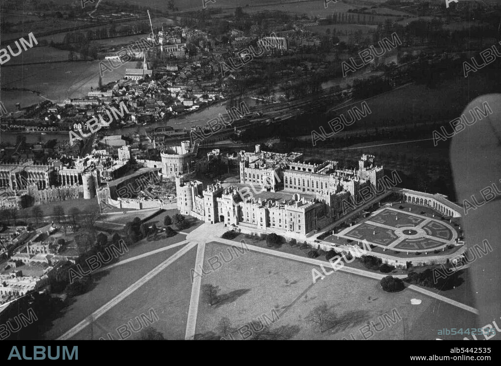 ***** By The Thames -Windsor - This aerial view of Windsor Castle ***** the King's private apartments over-taking the gardens on extreme right. ***** them on the farther side are the site Apartments. Near the center of the picture is the Round Tower and on the left, towards the river St. George's Chapel *****. ***** thirteenth century, though a residence has existed there from time of William the Conqueror in the 13th century. Additions were made by Henry VIII, Elizabeth and Charles II. Windsor park and Forest comprise over *****. April 3, 1946.