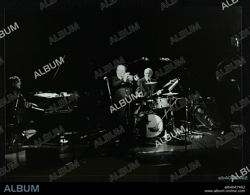 The Terry Lightfoot Band in concert at Oakmere House, Potters Bar, Hertfordshire, 7 October 1986. Dick Wellstood (piano). Billy Butterfield (trumpet), John Armatage (drums) and Mike Goodwin (double bass).