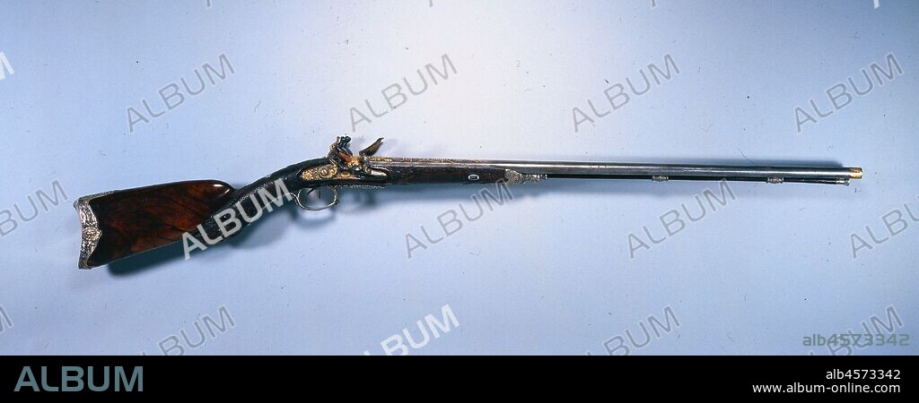 Double-Barrelled Flintlock Sporting Gun of Napoleon I Bonaparte, 1809. The Le Page family firm was the leading maker of deluxe firearms for the French nobility during the late 1700s and early 1800s. Jean Le Page was royal gun maker to the French king, Louis XVI (1774-93), and after the Revolution to the emperor, Napoleon Bonaparte (1804-21), who commissioned this weapon. The gun bears the imperial monogram "N" (for Napoleon) in two locations. Luxury shoulder arms were sporting weapons intended for hunting or target shooting and were often exquisitely decorated. These finely crafted guns and their accessories also served as appropriate diplomatic gifts for noteworthy individuals, including kings, noblemen, ambassadors, and military officers. Luxury firearms were genuine works of art, utilizing the skills of gunsmiths, woodcarvers, chiselers, goldsmiths, inlayers, and engravers. Because of their "deluxe" character and their sometimes commemorative purpose, such firearms were often intended as collectibles and as objects for personal display. They are beautifully carved of fine woods, embellished with personal monograms, coats-of-arms, and silver mounts, and are often inlaid with fanciful patterns in mother-of-pearl, bone, and ivory.