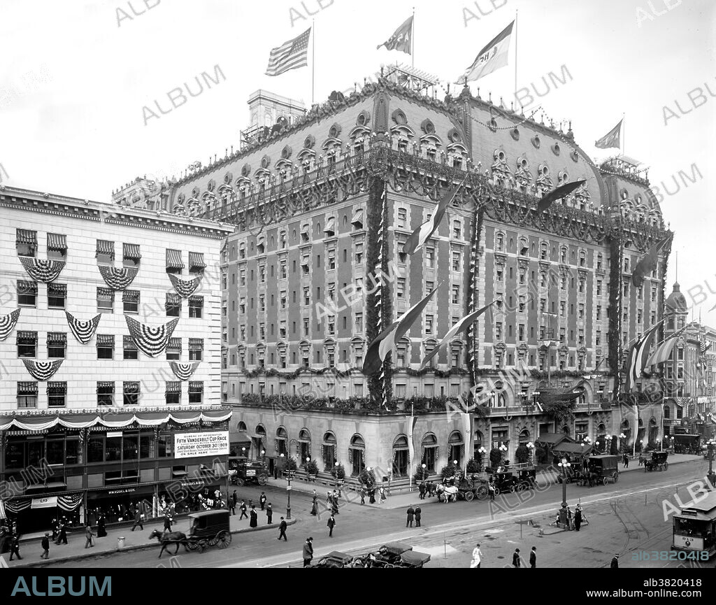 Hudson-Fulton celebration, 1909. Hotel Astor was located in the Times Square area of Manhattan, in operation from 1904-67. The 35,000 square feet Hotel Astor was built in two stages, in 1905 and 1909-10, by the architects Clinton and Russell. Upon completion, the structure occupied an entire city block at a reported total cost of $7 million. Within its restrained exterior, the Astor featured a long list of elaborately themed ballrooms and exotic restaurants. The rooftop garden, with bandstand and observatory, was one of a number constructed in the city between 1880 and Prohibition. The Astor was an important element in the growth of Times Square and its character as an entertainment center. The Astor set the pattern for "a new species of popular hotels that soon clustered around Times Square, vast amusement palaces that catered to crowds with scenographic interiors that mirrored the theatricality of the Great White Way." It closed and was demolished in 1967. Photographed by the Detroit Publishing Company, 1909.