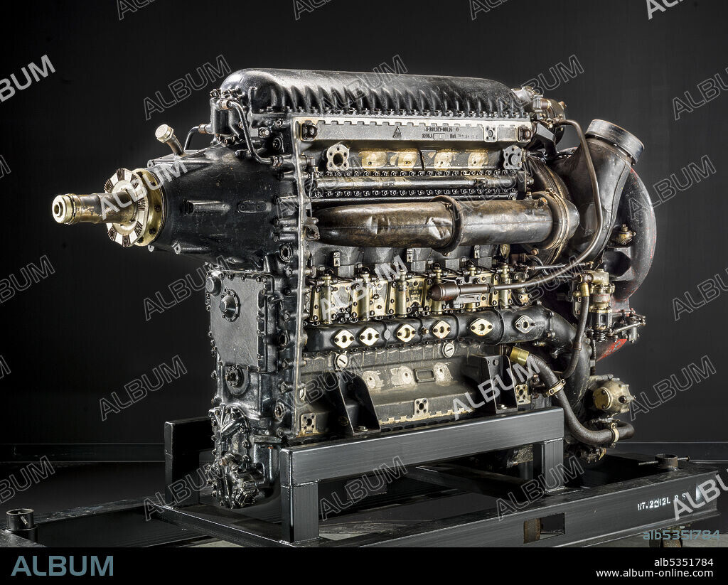 Dr. Hugo Junkers started development of his Diesel aircraft engines in a small factory at Dessau, Germany in 1911. His early engines functioned on the two-stroke cycle principle with piston-controlled parts, as did his later Junkers Jumo Diesels. Among the advantages of later, refined Diesel aircraft engines were lower specific fuel consumption (for long-range applications), lower exhaust gas temperature (for exhaust-driven supercharger installations), and reduced fire hazard as compared to conventional reciprocating aircraft engines. The Jumo 207 was a Jumo 205 with a turbo-supercharger. A Diesel operating on a two-stroke cycle, it incorporated six cylinders and 12 opposed pistons (i.e. 2 per cylinder) in an in-line, liquid-cooled configuration. The Jumo 207 could maintain its sea-level rated power to approximately 7,900 m (26,000 ft.). The Jumo 207 A and B powered the Junkers Ju 86 P and R reconnaissance/bomber aircraft that had an absolute ceiling of approximately 15,000 m (49,000 ft.).