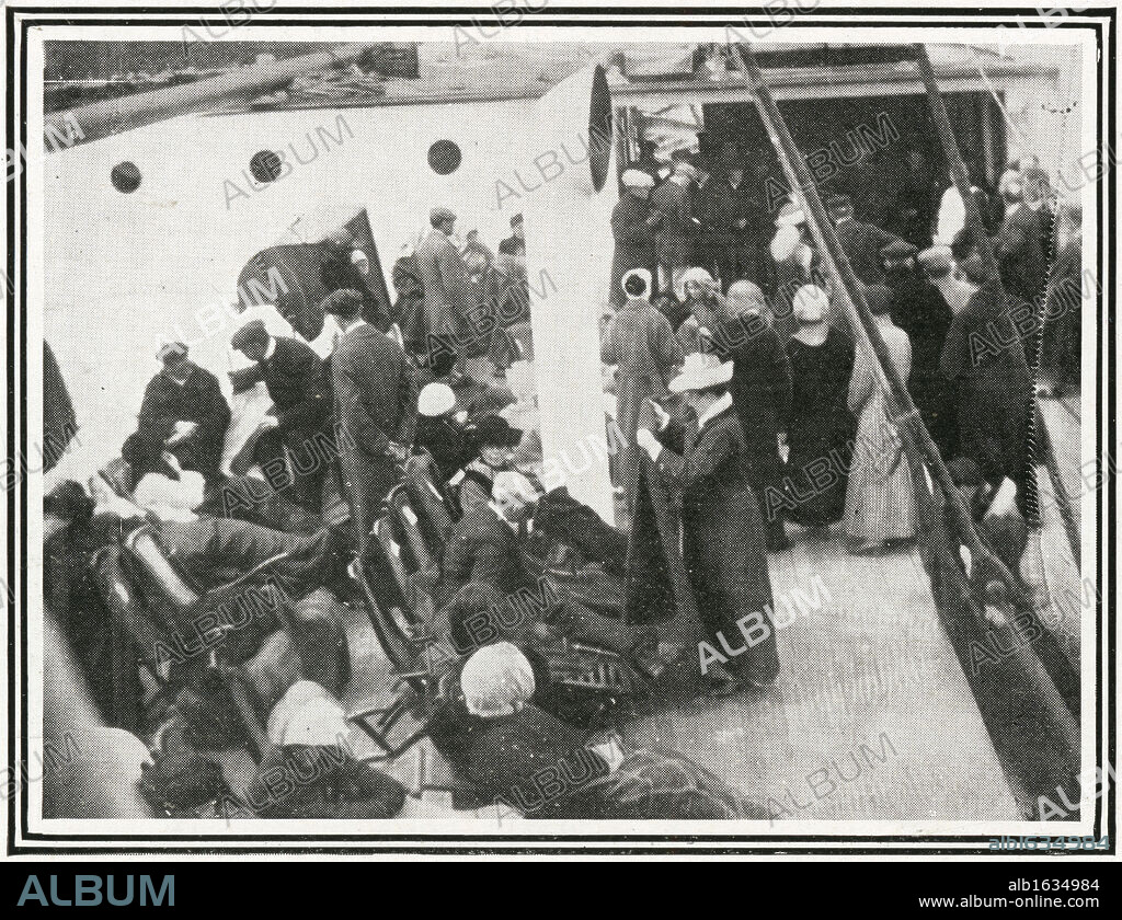 Titanic Survivors. How the Titanic Survivors Were Picked up by the Carpathia. Photograph taken by Mr J W Barker of Titanic survivors being waited on by Carpathia passengers. Carpathia was sailing from New York City to Rijeka on the night of Sunday, 14 April 1912. The captain, Arthur Henry Rostron, was asleep in his cabin when wireless operator Harold Cottam burst in and told him of Titanic's distress signal. Captain Rostron immediately set course to the liner's last known position, over 60 miles away. At 4 o'clock in the morning Carpathia arrived at the scene after working her way through dangerous ice fields and was able to save 705 people. Titanic was built by Harland & Wolff in Belfast Ireland during 1910 - 1911 and sank on April 15th, 1912 after striking an iceberg off the coast of New Foundland during her maiden voyage from Southampton, England to New York, USA, with the loss of 1,522 passengers and crew. (Photo by Titanic Images/Universal Images Group).