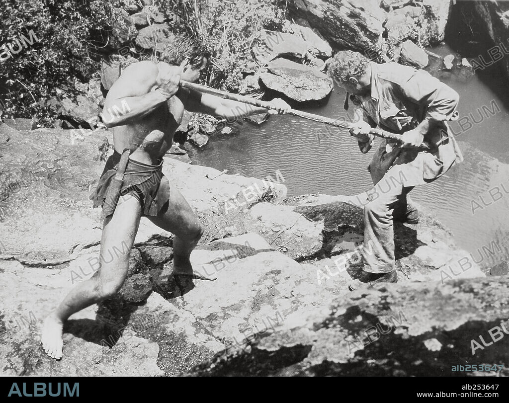 ANTHONY QUAYLE and GORDON SCOTT in TARZAN'S GREATEST ADVENTURE, 1959, directed by JOHN GUILLERMIN. Copyright PARAMOUNT PICTURES.