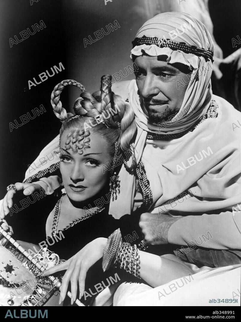 MARLENE DIETRICH and RONALD COLMAN in KISMET, 1944, directed by WILHELM DIETERLE. Copyright M.G.M.