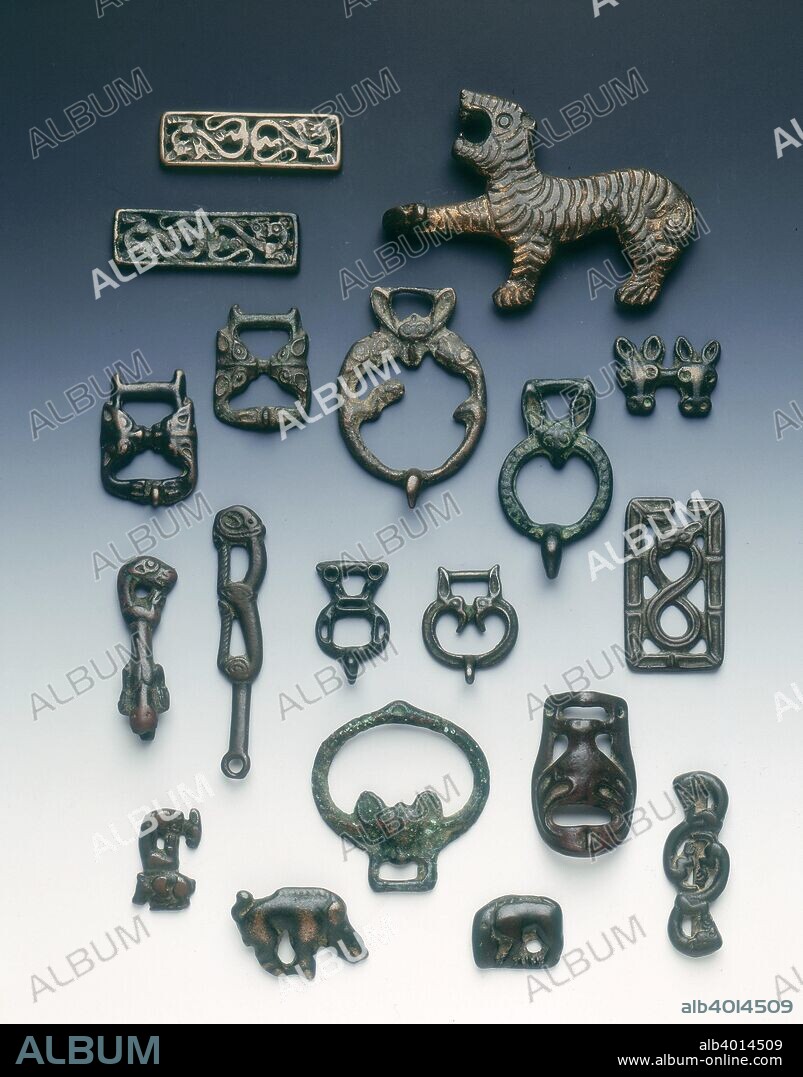 Ordos bronzes, 7th-1st century BC. A group of 19 Ordos bronzes including garment hooks and plaques from the Ordos region, south-western Inner Mongolia.