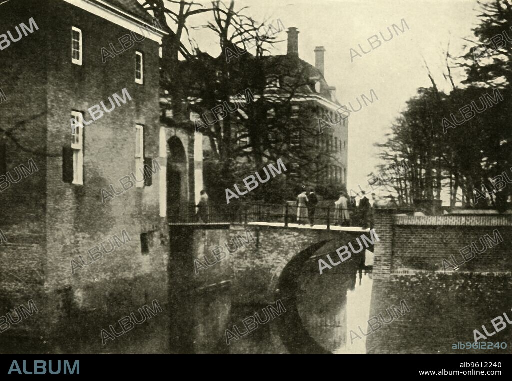 Kaiser Wilhelm II at Amerongen Castle, Netherlands, 1918, (c1920). 'The Ex-Kaiser in Exile: a snapshot of the deposed emperor, with his suite, on the bridge over the moat at Amerongen, the castle of Count [Godard] Bentinck, where William II sought refuge in his flight into Holland'. After the signing of the Armistice at the end of the First World War, German emperor Wilhelm issued a belated statement of abdication from both the Prussian and imperial thrones. From "The Great World War: A History", Volume IX, edited by Frank A Mumby. [The Gresham Publishing Company Ltd, London, c1920].