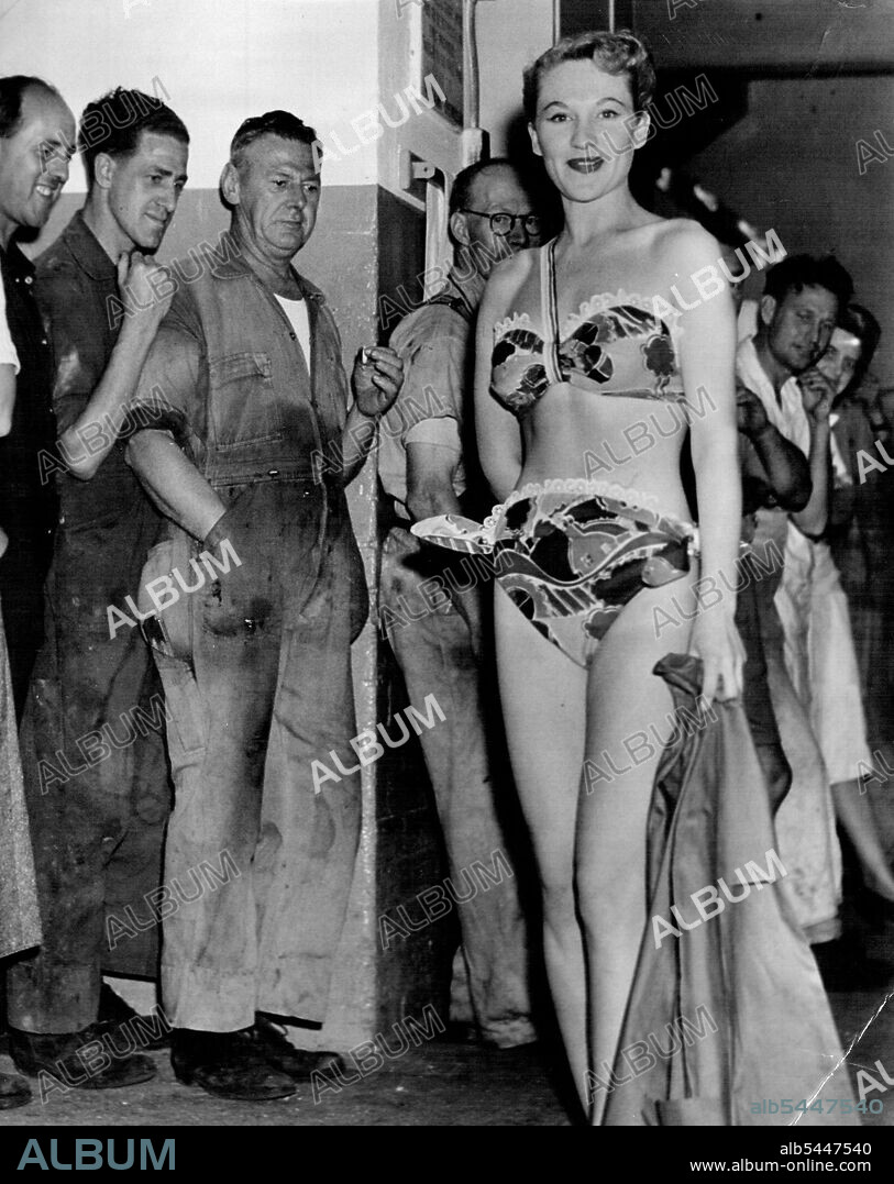 Noni Piper, model French swim suit at a fashion while you work parade held at ***** food factory today. Fashion by *****. November 17, 1950.