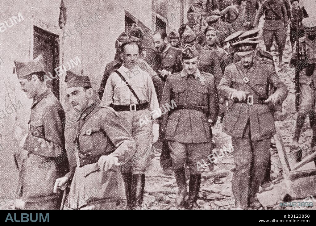 Franco visiting defenders of the Alcazar of Toledo on the day when members of the Board of National Defense elect Franco, Generalissimo and Head of Government of the Spanish State.