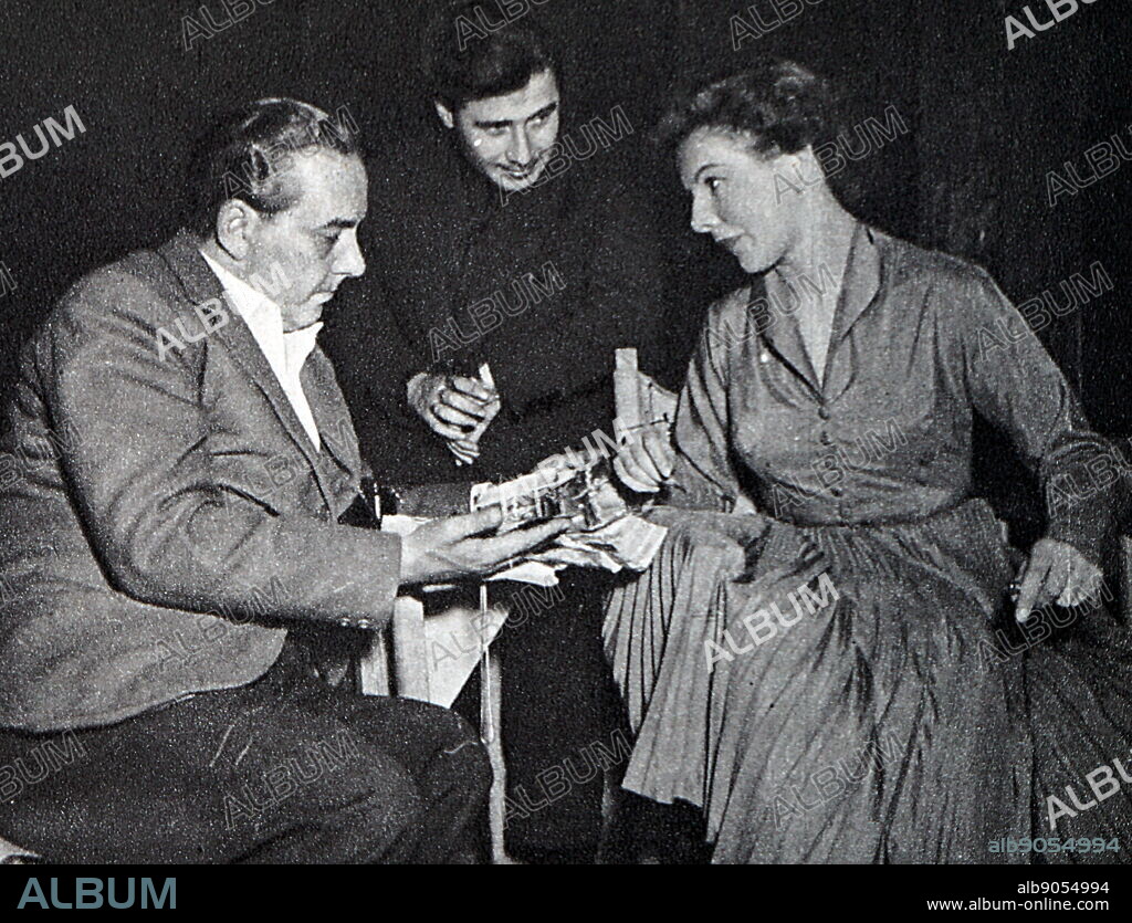 Photograph of Mario Zampi (1903-1963) with Noelle Middleton (1926-2016) and Ivan King (1922-) on the set of 'Happy Ever After'.