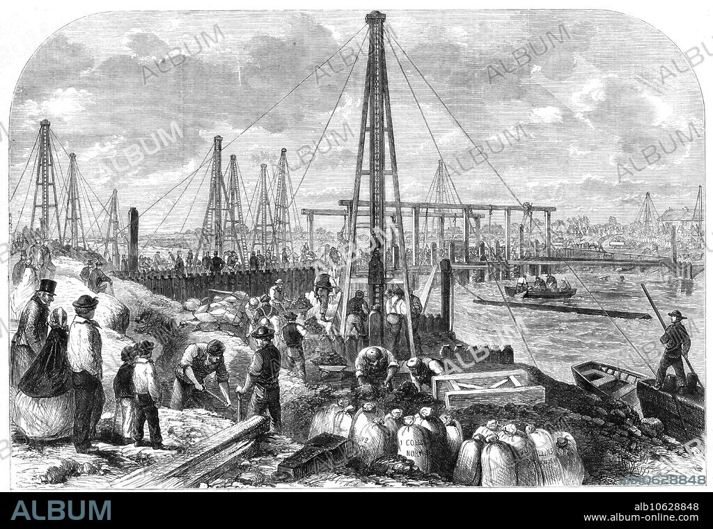 The Flood in the Fens: making the cofferdam, 1862. 'The hopes, mingled largely with fears, of the Marshland farmers are centred upon the gigantic cofferdam which Mr. Leather, the contractor, has pushed across the Middle-Level Drain, about half a mile above the blown-up sluice. The framework of this dam consists of a great number of piles...which are driven to a depth of twenty feet in the earth. All these piles are girded together by iron bolts fixed into the bed of the river by expert divers...The banks were lined with sacks of clay to the number of many thousands, and bodies of men were engaged in digging up mere earth and filling in new sacks...it became painfully apparent to all that the dam had burst, from the boiling, seething waters on the upper side of the dam...It was found to be necessary to take up the portions of panels, otherwise it was feared that the whole dam would be carried away...some divers were sent down to ascertain the extent of the damage. They found that one of the panels had been completely shattered...Two or three of the principal piles were also broken...It appears, however, that the engineers are still confident that they will be able to construct works sufficiently strong to keep out the heaviest tides'. From "Illustrated London News", 1862.