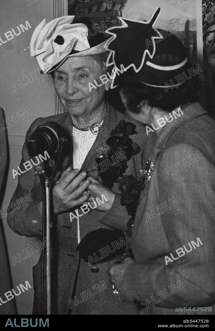 Miss Helen Keller, famous American blind & deaf authoress who will make an extensive tour of Australia talks into the microphone on arrival. With her is the right is Miss Polly Thompson her companion for 34 years and they converse with rapidity by means of the hands. March 29, 1948. (Photo by Frederick John Halmarick/Fairfax Media).