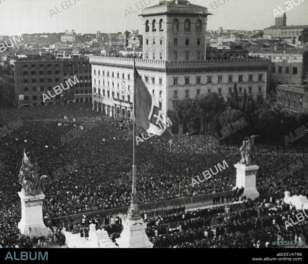 Multitude Cheers Duce's War Decree --  The multitude which cheered Premier Benito Mussolini as he announced from the balcony of the Palazzo Venezia in Rome June 10 that Italy had declared war on Britain and France. Other throngs gathered at squares throughout the nation heard the declaration from loud speakers. "We are descending to battle fields against plutocratic reactionary democracies, Duce declared. June 21, 1940. (Photo by Associated Press-Paramount News Photo).