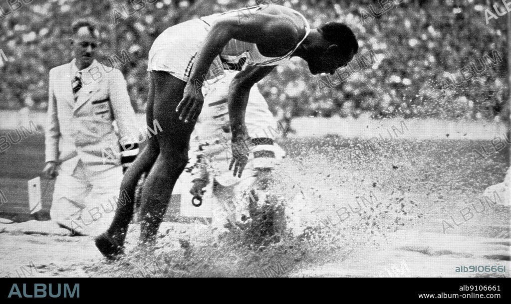 Jesse Owens winning the broad jump Olympic Games Berlin 1936.