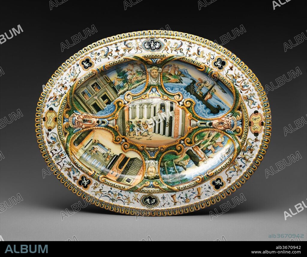 Oval basin or dish with subject from Amadis of Gaul. Artist: Workshop of Orazio Fontana (Italian, Urbino, ca. 1510-1576). Culture: Italian, Urbino or possibly Turin. Dimensions: Overall (confirmed): 2 1/2 × 26 1/4 × 20 7/8 in. (6.4 × 66.7 × 53 cm). Date: ca. 1559-64.
This basin is decorated with scenes from the chivalric tale of Amadis, who endured a number of trials in order to win his beloved princess, Oriana. Large serving dishes of this type would have been used communally, placed on the table within reach of several diners. In this case, the number and placement of the scenes suggest that it was intended to serve four, each with an image oriented in his or her direction.