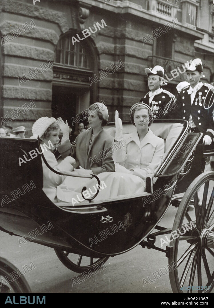 Princesses Desiree, Margareta and Birgitta of Swden, Stockholm, 1951. Princess Desiree (1938-), Princess Margaretha (1934-) and Princess Birgitta (1937-), the three eldest children of Prince Gustaf Adolf, Duke of Västerbotten and Princess Sibylla of Saxe-Coburg and Gotha, riding in a carriage on Sweden's National Day. From the collection of Svenskt Fotoreportages.