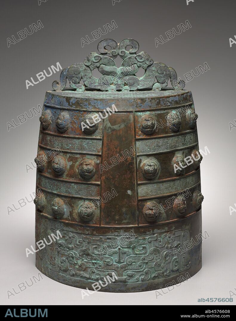 Bell (Bo Zhong), early 400s BC. Music in the Eastern Zhou dynasty not only served ritual purposes but also provided entertainment in feudal courts. The elliptical cross-section of the Chinese bronze bell is unique; it could produce two notes depending on where the bell is struck, either at the rim or near the center. The bell is suspended when played and often belongs to a graduated set arranged according to pitch and size. This bell displays elaborate ornamentation and exquisite workmanship. A twin-bodied serpent intertwined with two tigers forms the suspension loop at the top. Coiled serpents form the knobs on the body. The lower part bears an animal mask, its horns interlaced with abstract bird designs.