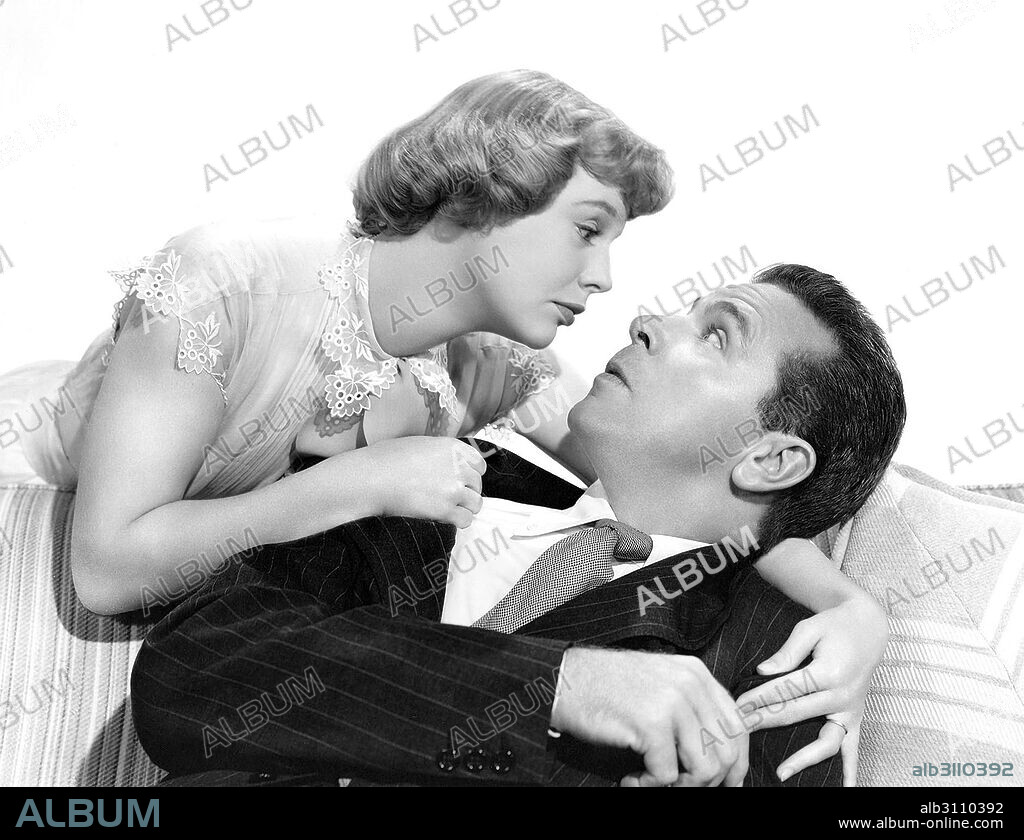 DICK POWELL and JUNE ALLYSON in THE REFORMER AND THE REDHEAD, 1950, directed by MELVIN FRANK and NORMAN PANAMA. Copyright METRO GOLDWYN MAYER.