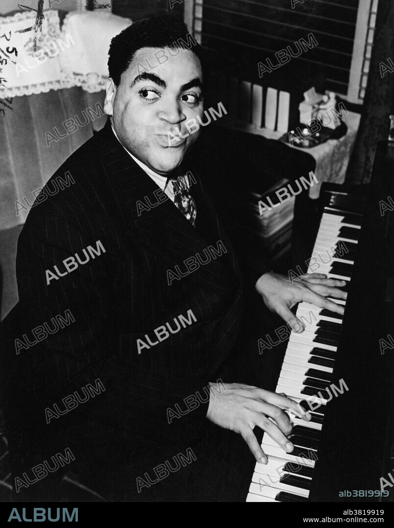 Waller playing the piano in 1938. Fats Waller (May 21, 1904 - December 15, 1943), born Thomas Wright Waller, was an African-American jazz pianist, organist, composer, singer, and comedic entertainer. He was one of the most popular performers of his era, finding critical and commercial success in his homeland and in Europe. He was also a prolific songwriter and many songs he wrote or co-wrote are still popular. Between 1926 and the end of 1927, Waller recorded a series of pipe organ solo records. These represent the first time syncopated jazz compositions were performed on a full-sized church organ. He appeared in several feature films and short subject films, most notably Stormy Weather in 1943, which was released just months before his death. He ontracted pneumonia and died on a cross-country train trip near Kansas City, on December 15, 1943, after making a final recording session. He was 39 years old. Recordings of Fats Waller were inducted into the Grammy Hall of Fame which is a special Grammy award established in 1973 to honor recordings that are at least 25 years old and have qualitative or historical significance.