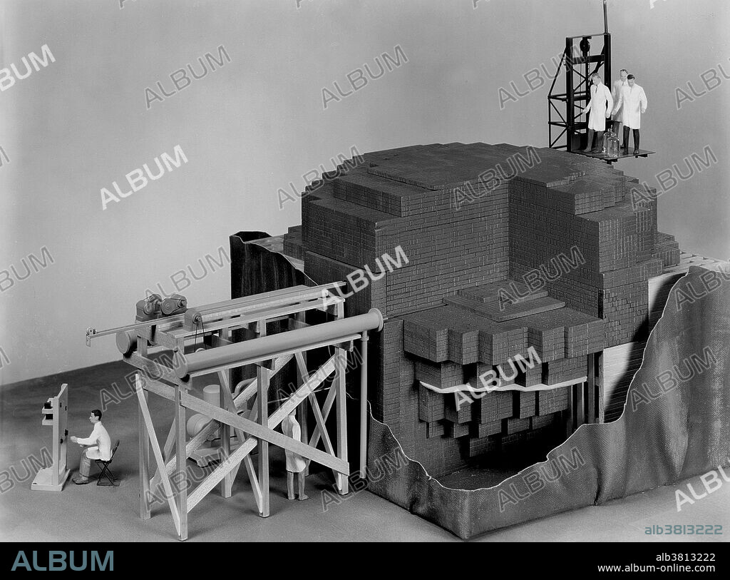 Closeup of scale model (1/2 in. = 1 ft.) of CP-1 reactor temporarily removed from its West Stands racquets court environment. Chicago Pile-1 (CP-1) was the world's first artificial nuclear reactor. The construction of CP-1 was part of the Manhattan Project, and was carried out by the Metallurgical Laboratory at the University of Chicago. It was built under the west viewing stands of the original Stagg Field. The first man-made self-sustaining nuclear chain reaction was initiated in CP-1 on December 2, 1942, under the supervision of Enrico Fermi. Fermi described the apparatus as "a crude pile of black bricks and wooden timbers." It was made of a large amount of graphite and uranium, with "control rods" of cadmium, indium, and silver, and unlike most subsequent reactors, it had no radiation shield or cooling system. Upon completion of the experiment, a coded message was transmitted to President Roosevelt: "The Italian navigator has landed in the new world.".