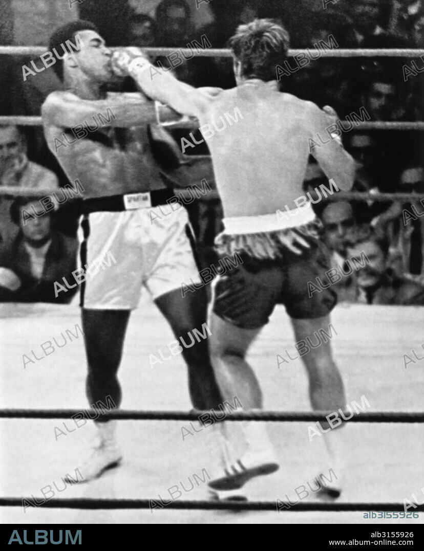 Atlanta, Georgia:  October 26, 1970 Jerry Quarry slams a left into Muhammad Ali's mouth in the second round of their fight. The fight was stopped after the third round because of Quarry's badly battered eye.