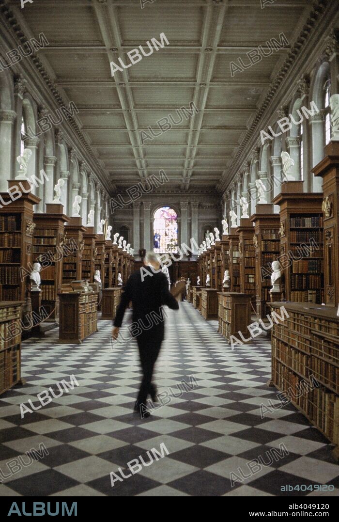 Wren Library, Trinity College, Cambridge University, Cambridgeshire, 1967. The library of Trinity College was designed by Christopher Wren and was completed in 1695. The ends of the book stacks feature limewood carvings by Grinling Gibbons with plaster cast busts of notable writers on top.