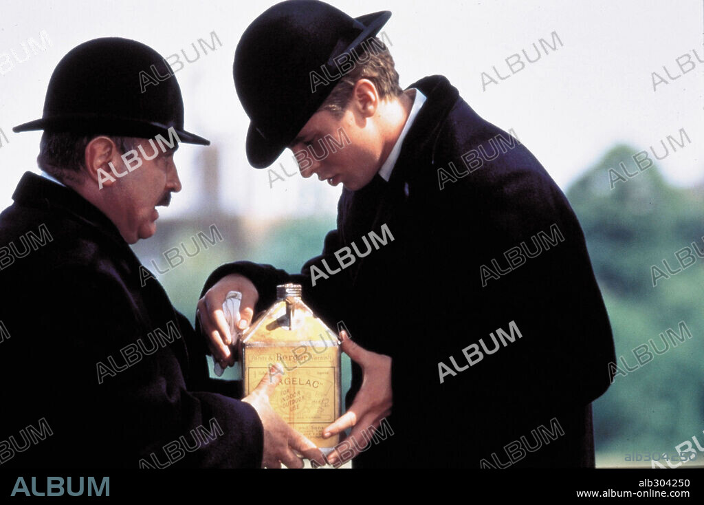 BOB HOSKINS and CHRISTIAN BALE in THE SECRET AGENT, 1996, directed by CHRISTOHER HAMPTON. Copyright 20TH CENTURY FOX.