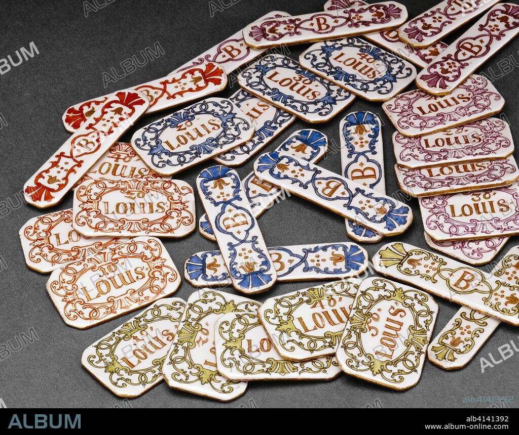 Gaming Pieces. Du Paquier Porcelain Manufactory; Austrian, 1718-1744. Date: 1735-1740. Dimensions: #1 & #2: 1/2 × 1 in. (3.8 × 2.5 cm)
#3 & #4: 2 3/16 × 9/16 in. (5.6 × 1.4 cm). Hard-paste porcelain, polychrome enamels, gilding. Origin: Vienna.