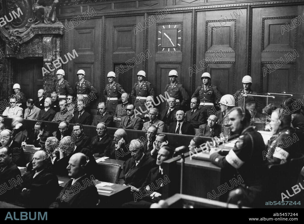 This was the scene on the day of Reckoning -- This historic judgement of Nuremberg, delivered yesterday by British, French, American and Russian judges, decided "that certain of the defendants planned and waged aggressive war against is nations and were therefore ***** of this series of crimes".Nazi Germany's 21 former leaders will hear their individual guilt and the sentences to be awarded today.With their counsel in front and united states guards at the back, the accused listen to be justice Lawrence at Nuremberg. October 1, 1946.