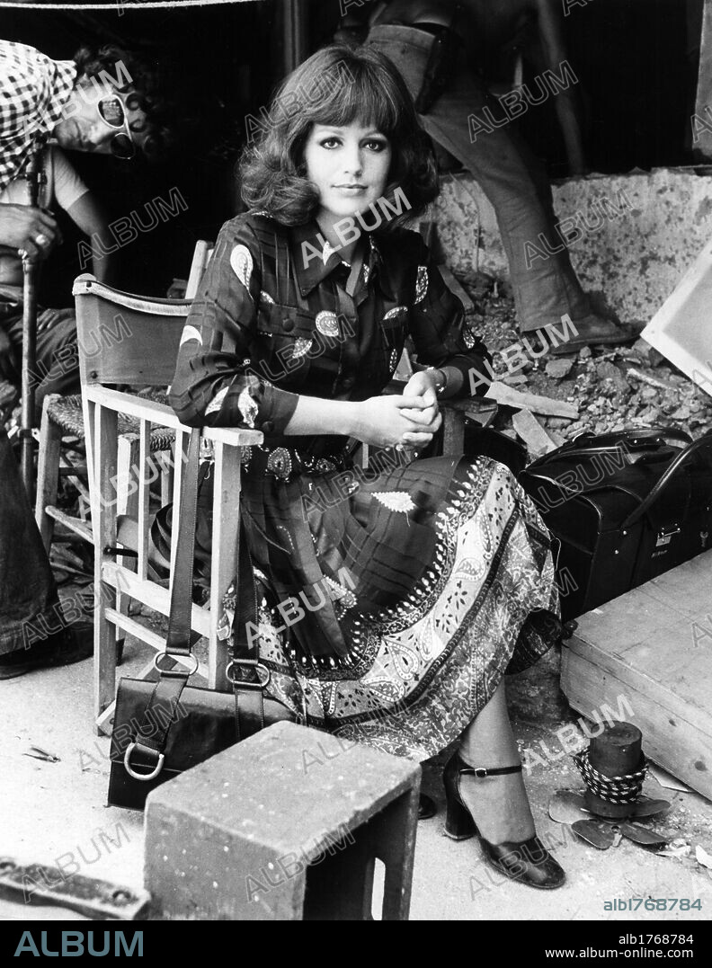 Catherine Spaak on a movie set. French actress, singer, dancer and TV presenter Catherine Spaak sitting on a movie set. Rome, 1970s.